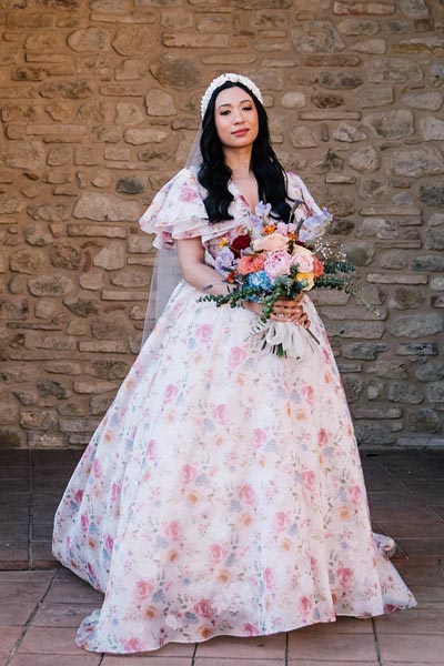 Samantha posing in her custom wedding dress