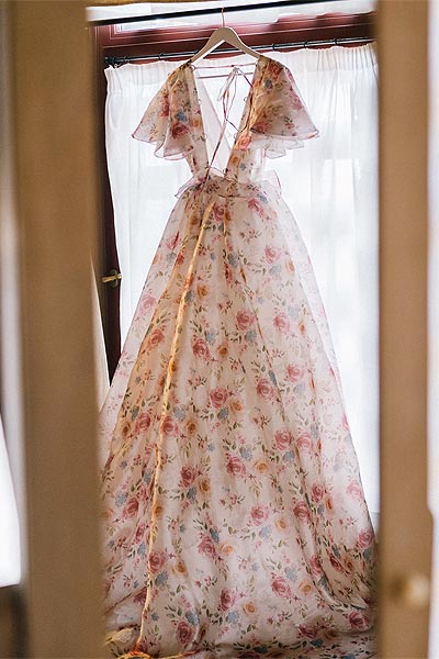 Samantha's wedding dress on a hanger