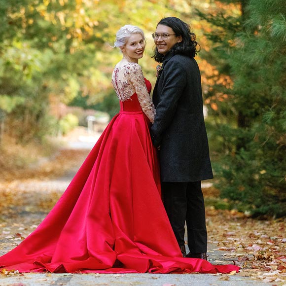 Sunny posing in her red custom wedding dress with Eduardo