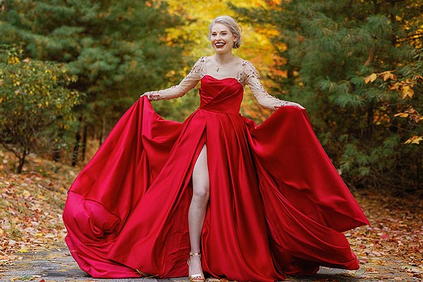 Sunny showing off her custom red wedding gown