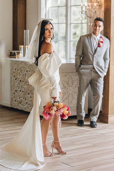 Veronica's custom wedding dress features Juliet sleeves