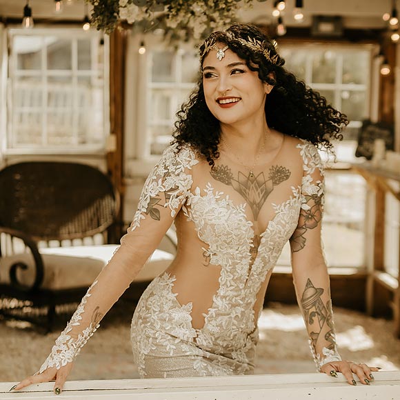 Yume posining her sexy cutout wedding gown.