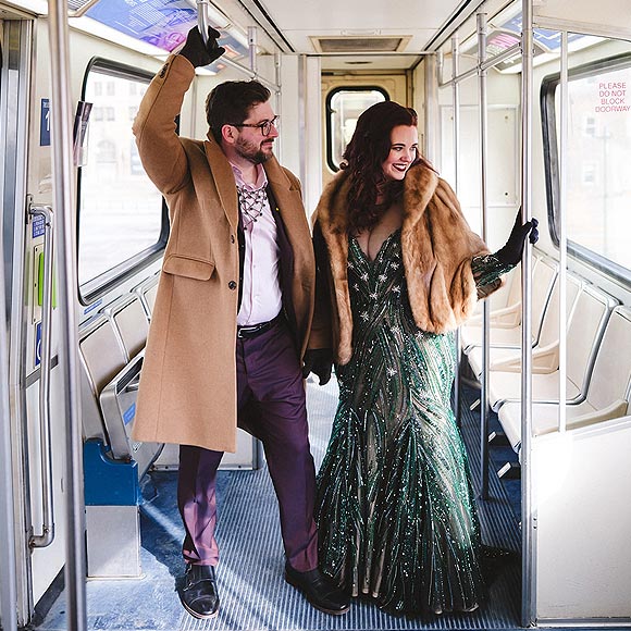 Tyler posing with Jessica in her custom green wedding dress
