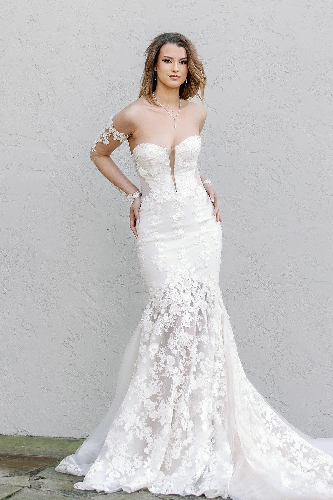 Kyra posing in her custom bridal gown