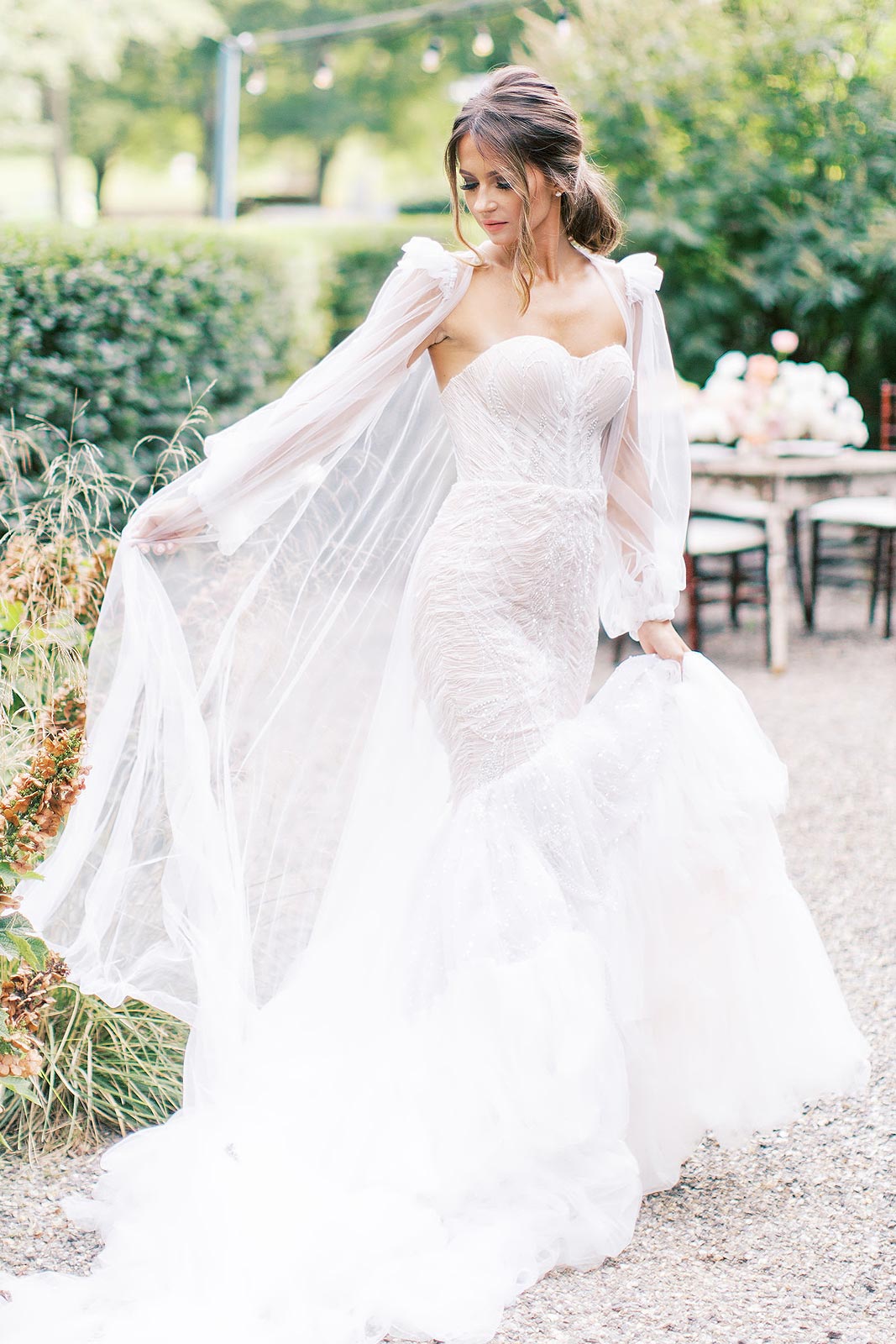 Oksana wearing her custom wedding dress with sleeves