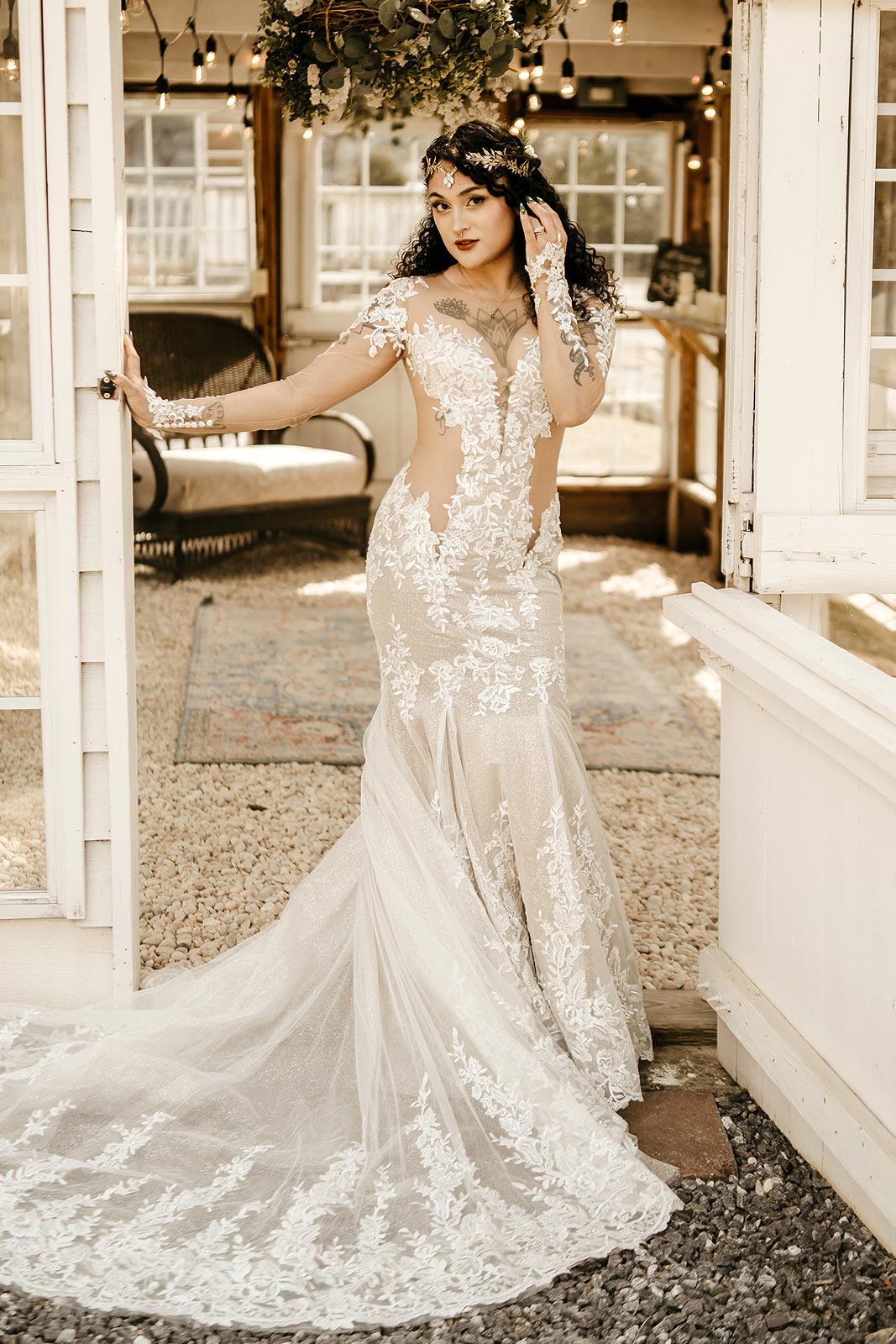 Yume posing in her sexy lace wedding dress with illusion sleeves