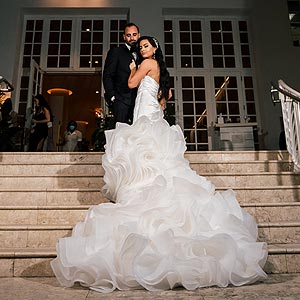 Chelsea wedding her organza wedding dress with a a long statement train.